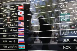 فهرست نرخ ارزهای مختلف از جمله ین ژاپن (JPY) و یوآن چین (CNY) روی شیشه